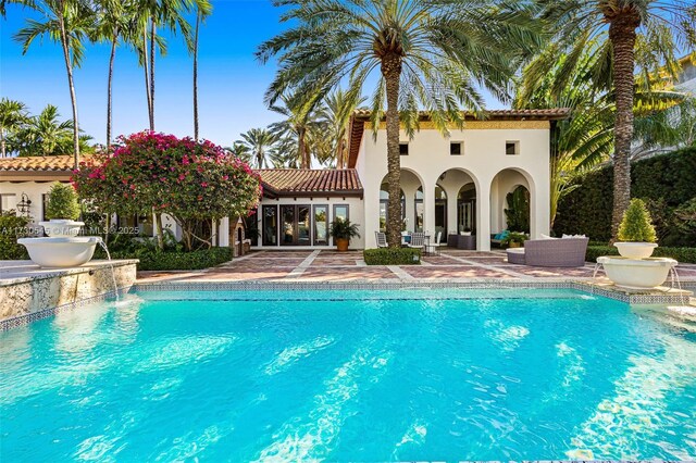 view of pool featuring pool water feature