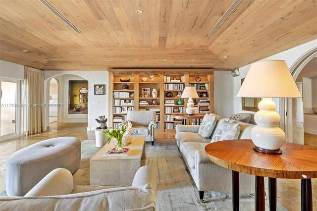 living room with wood ceiling, a raised ceiling, vaulted ceiling, and light wood-type flooring