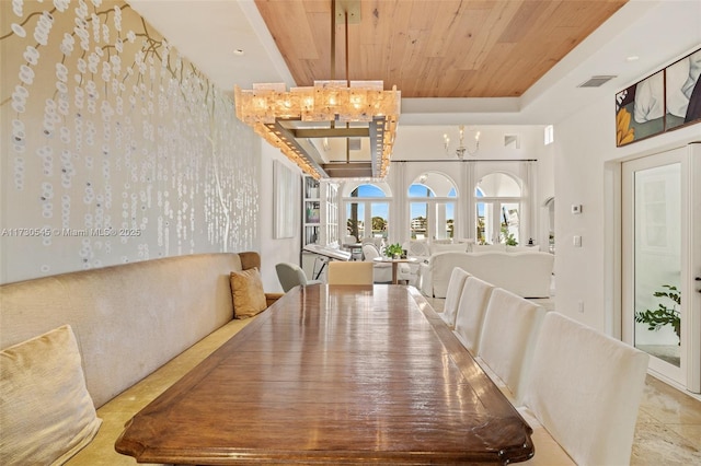 dining area featuring wooden ceiling and a chandelier