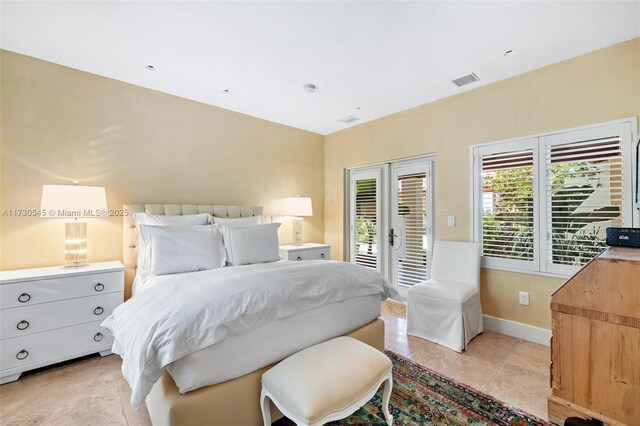 tiled bedroom featuring access to outside