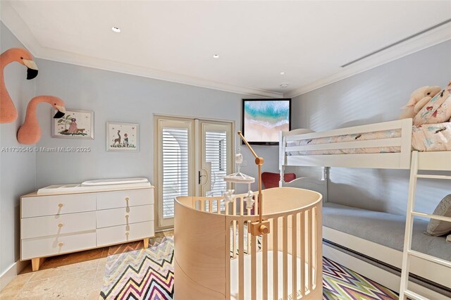 bedroom with ornamental molding, access to exterior, and light wood-type flooring