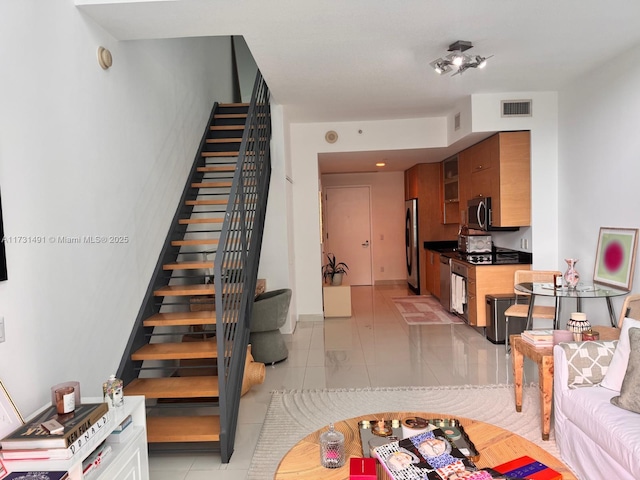 staircase with tile patterned flooring