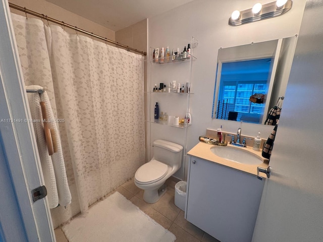 bathroom with vanity, tile patterned floors, and toilet