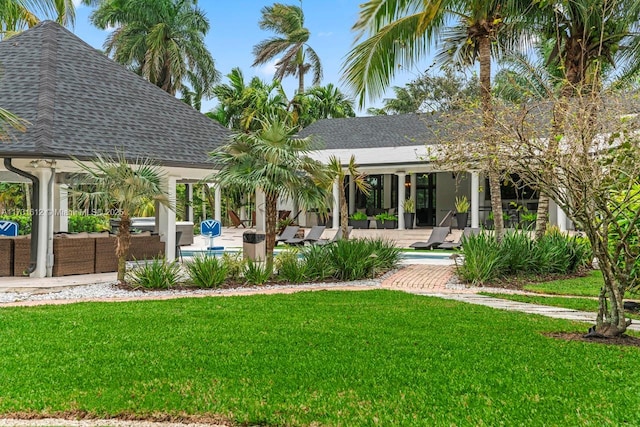 rear view of house with an outdoor hangout area, a yard, and a patio area