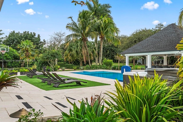 view of swimming pool featuring a gazebo and a patio area