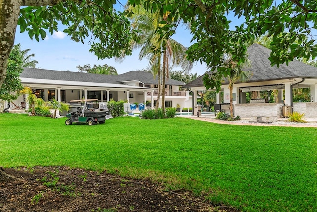 back of house with a gazebo, a patio area, and a lawn