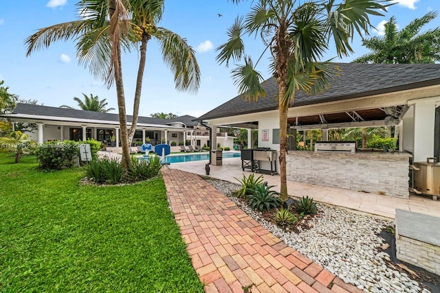 view of patio featuring exterior kitchen and exterior bar