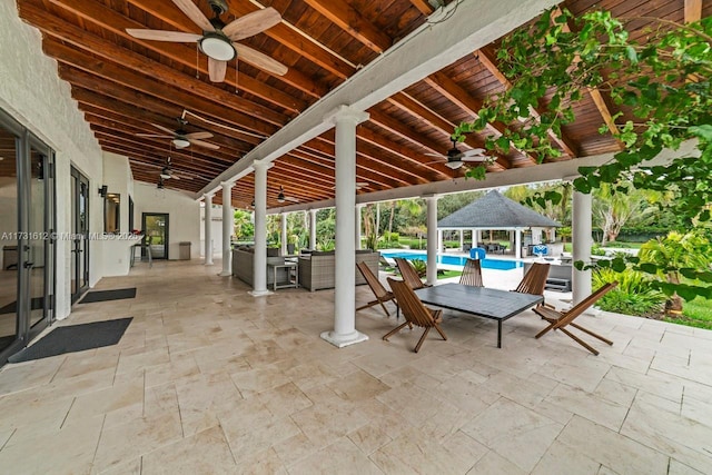 view of patio featuring a gazebo and ceiling fan