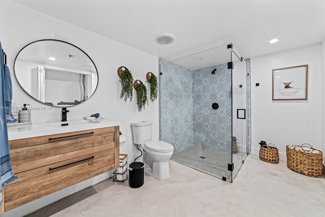 bathroom with vanity, toilet, and an enclosed shower