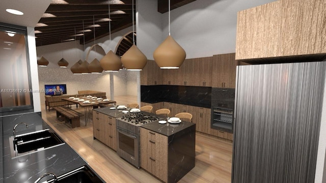 kitchen featuring sink, light hardwood / wood-style floors, and stainless steel gas cooktop