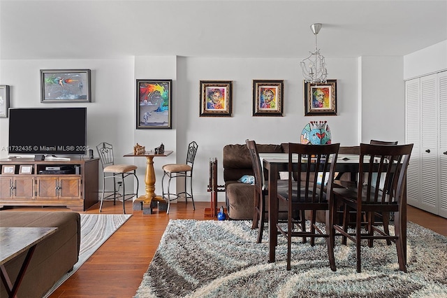 dining room with an inviting chandelier and hardwood / wood-style floors