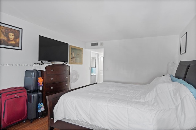 bedroom featuring dark wood-type flooring