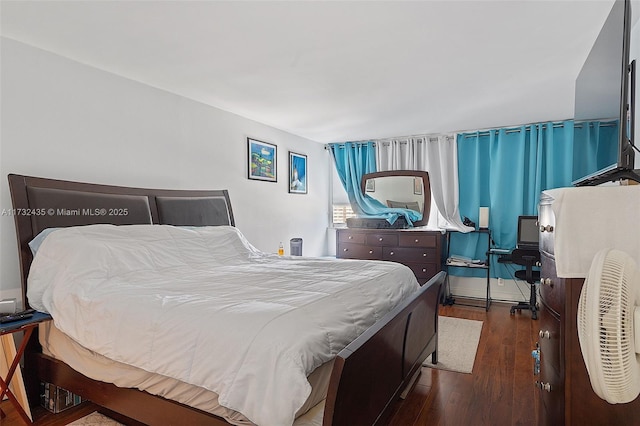 bedroom featuring dark hardwood / wood-style flooring