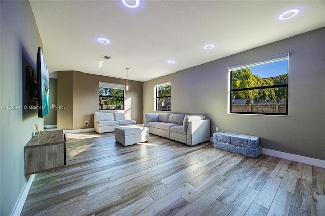 living room with light hardwood / wood-style flooring