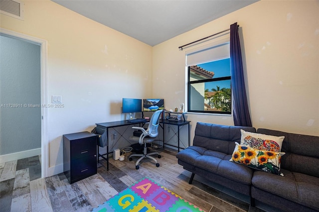 office space with wood-type flooring