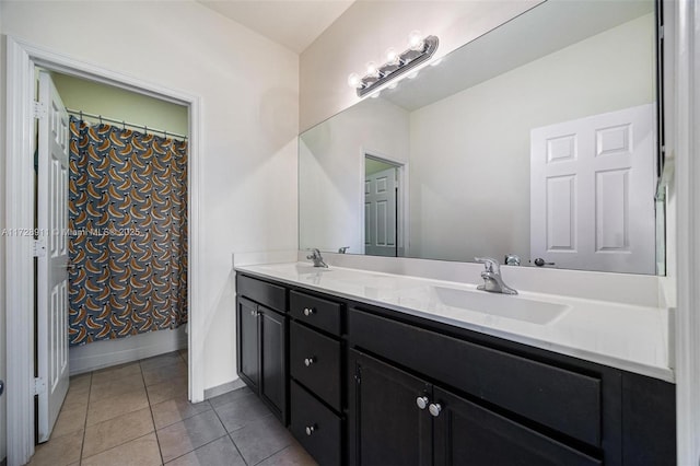 bathroom with tile patterned flooring, vanity, and shower / bath combo