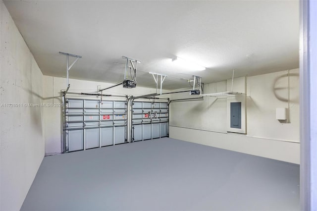 garage featuring a garage door opener and electric panel