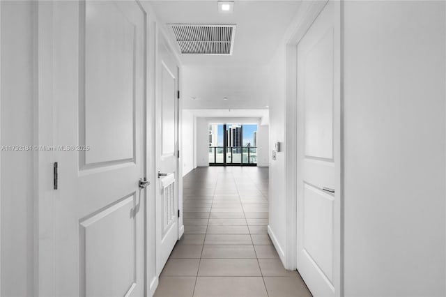 hallway featuring light tile patterned floors