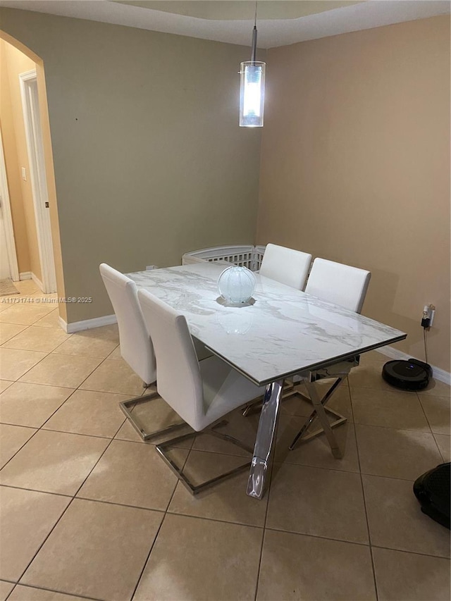 dining space with light tile patterned floors