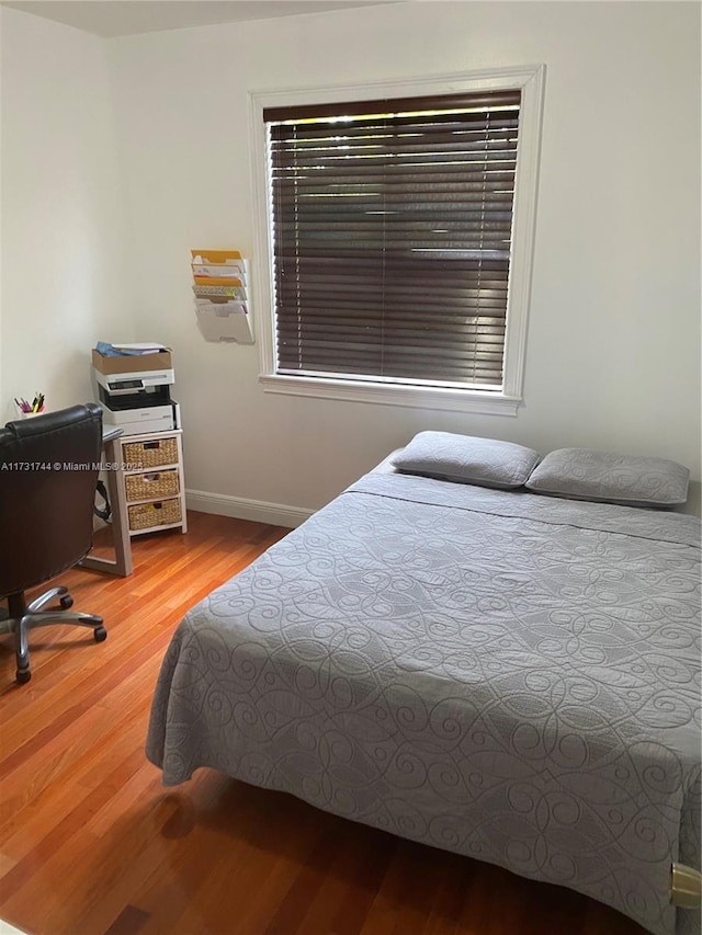 bedroom with light wood-type flooring