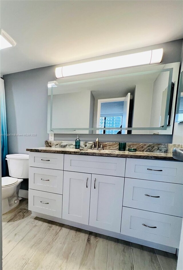 2301 S Ocean Dr Unit 2408, Hollywood, FL 33019 - full bath with toilet, wood finished floors, and vanity