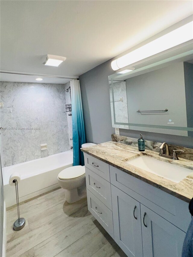 2301 S Ocean Dr Unit 2408, Hollywood, FL 33019 - full bathroom with vanity, shower / bath combo, toilet, and wood finished floors