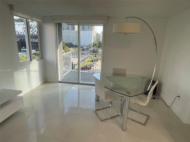 tiled dining space with baseboards