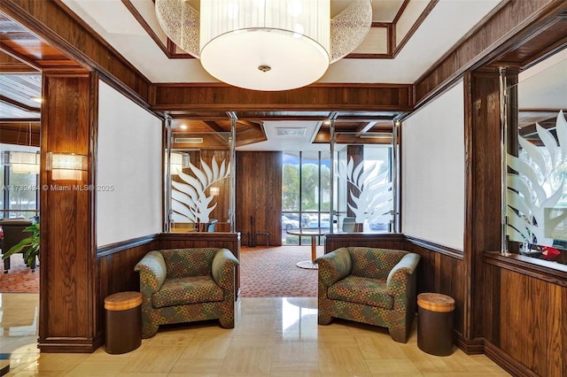 sitting room featuring wooden walls