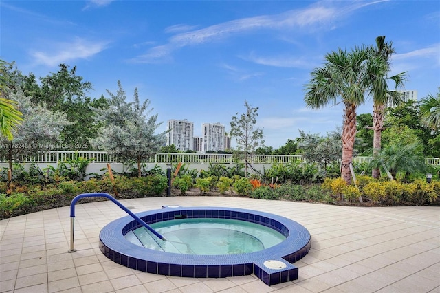 view of pool with a community hot tub