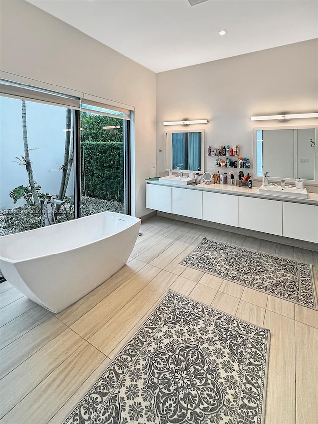 bathroom featuring a bathing tub and vanity