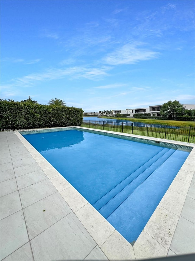 view of pool with a water view