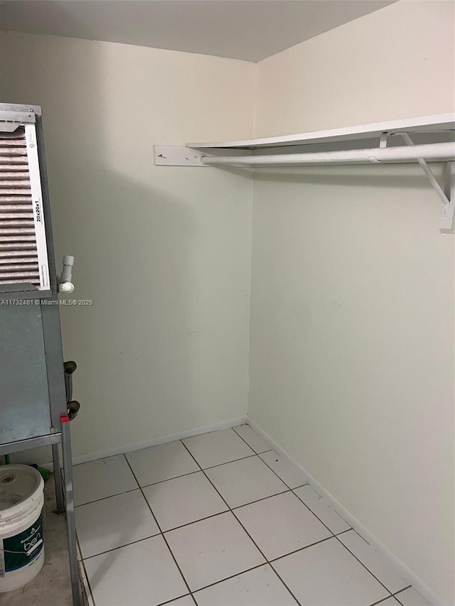 spacious closet with tile patterned floors