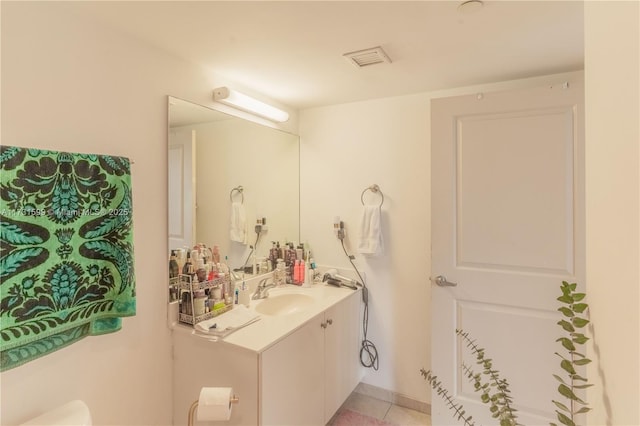 bathroom with vanity and tile patterned flooring