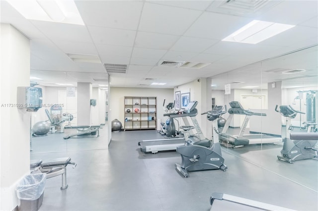 workout area featuring a drop ceiling