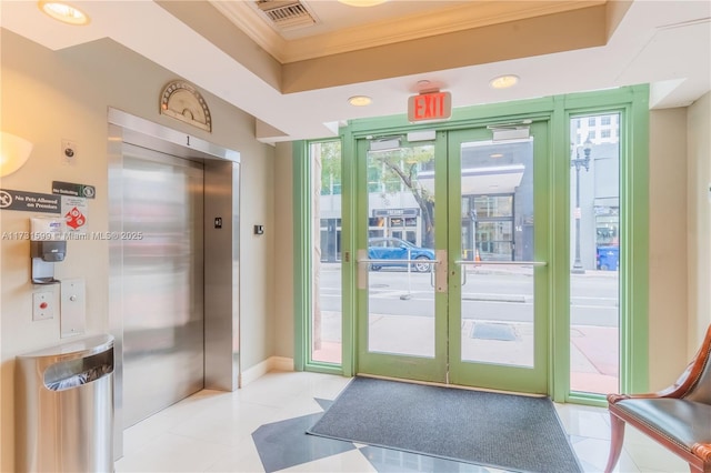 doorway to outside featuring french doors, elevator, ornamental molding, and floor to ceiling windows