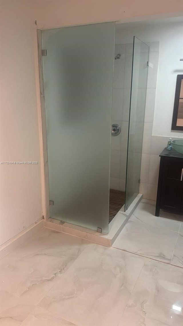 bathroom with vanity and an enclosed shower