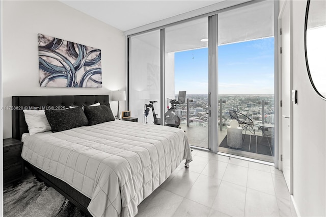 tiled bedroom with multiple windows, access to exterior, and a wall of windows