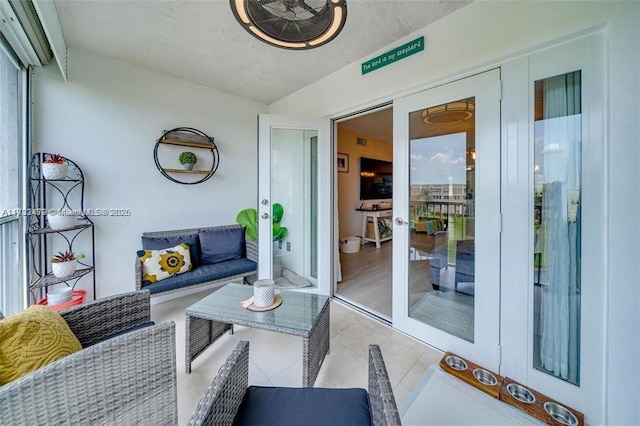 interior space featuring a healthy amount of sunlight and light tile patterned floors