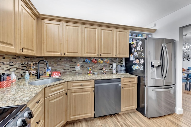 kitchen featuring sink, light hardwood / wood-style flooring, stainless steel appliances, tasteful backsplash, and light stone countertops