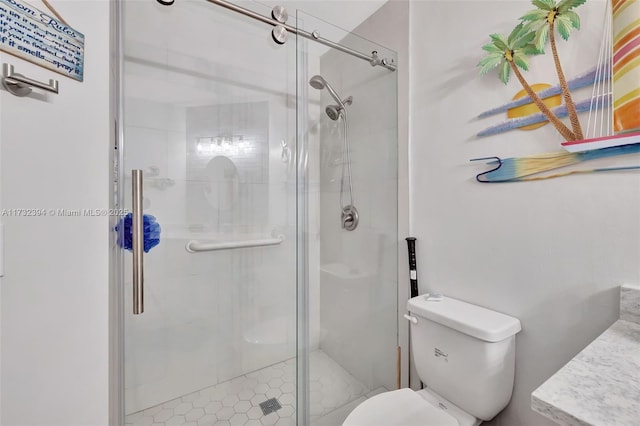 bathroom with vanity, toilet, and an enclosed shower