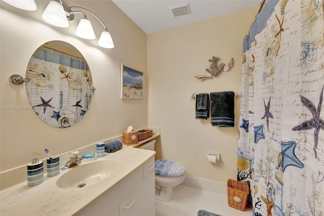 bathroom with vanity, toilet, and a shower with shower curtain