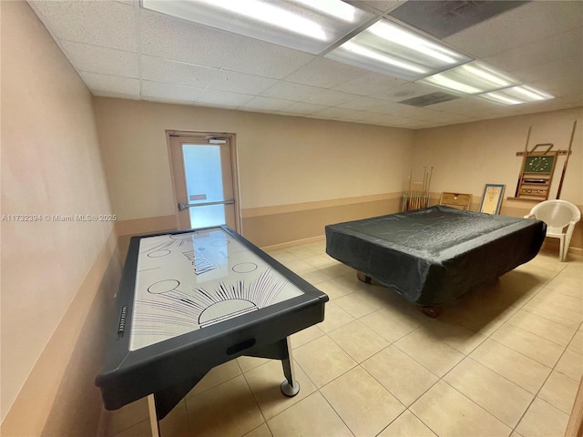 game room featuring a drop ceiling, light tile patterned floors, and pool table