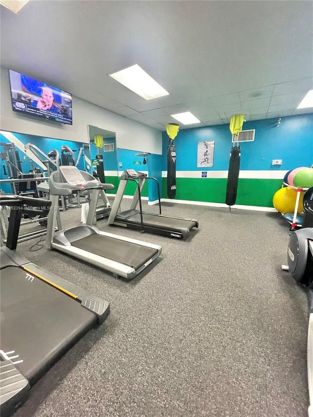 gym featuring a drop ceiling