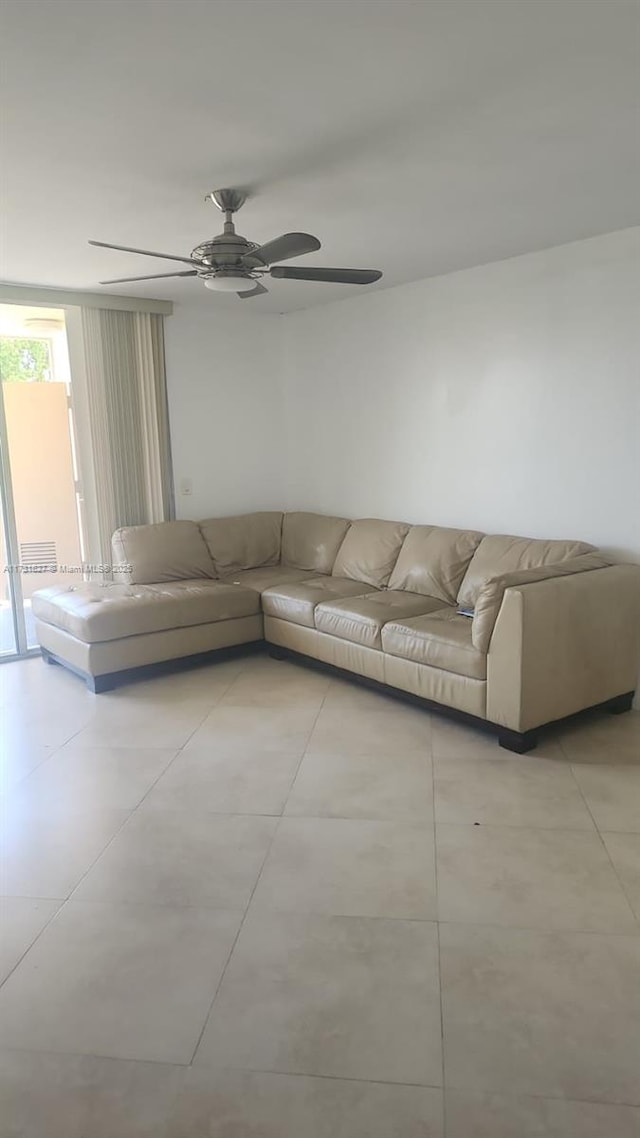 unfurnished living room featuring ceiling fan