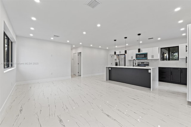 2814 SW 92nd Ct, Miami, FL 33165 - kitchen with pendant lighting, sink, appliances with stainless steel finishes, white cabinets, and a kitchen island