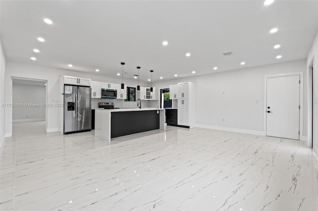 2814 SW 92nd Ct, Miami, FL 33165 - kitchen with pendant lighting, stainless steel appliances, a kitchen island, and white cabinets