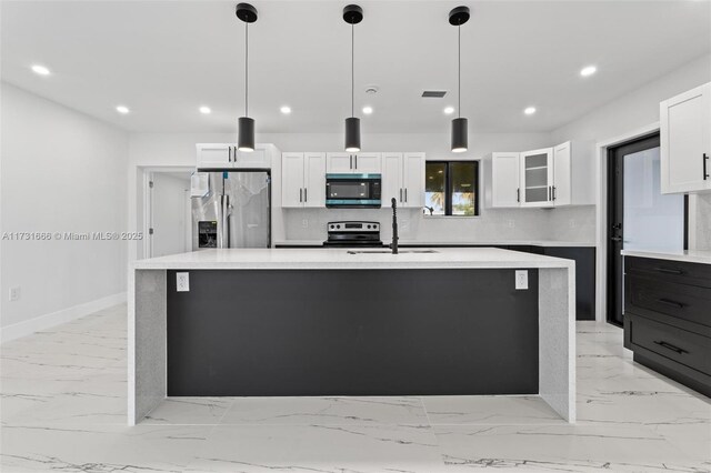 2814 SW 92nd Ct, Miami, FL 33165 - kitchen featuring stainless steel appliances, white cabinetry, hanging light fixtures, and sink