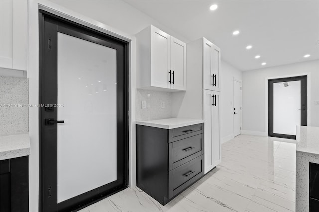 2814 SW 92nd Ct, Miami, FL 33165 - kitchen with backsplash, gray cabinets, and white cabinets