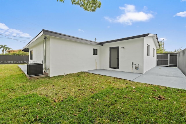 2814 SW 92nd Ct, Miami, FL 33165 - rear view of house featuring a yard, a patio, and central air condition unit