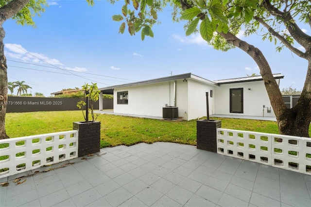 2814 SW 92nd Ct, Miami, FL 33165 - view of front of home featuring cooling unit, a front yard, and a patio